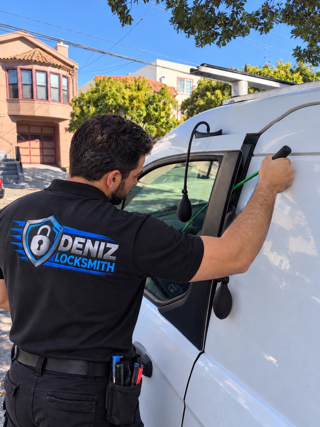 DENIZ LOCKSMITH technician opening a locked car door