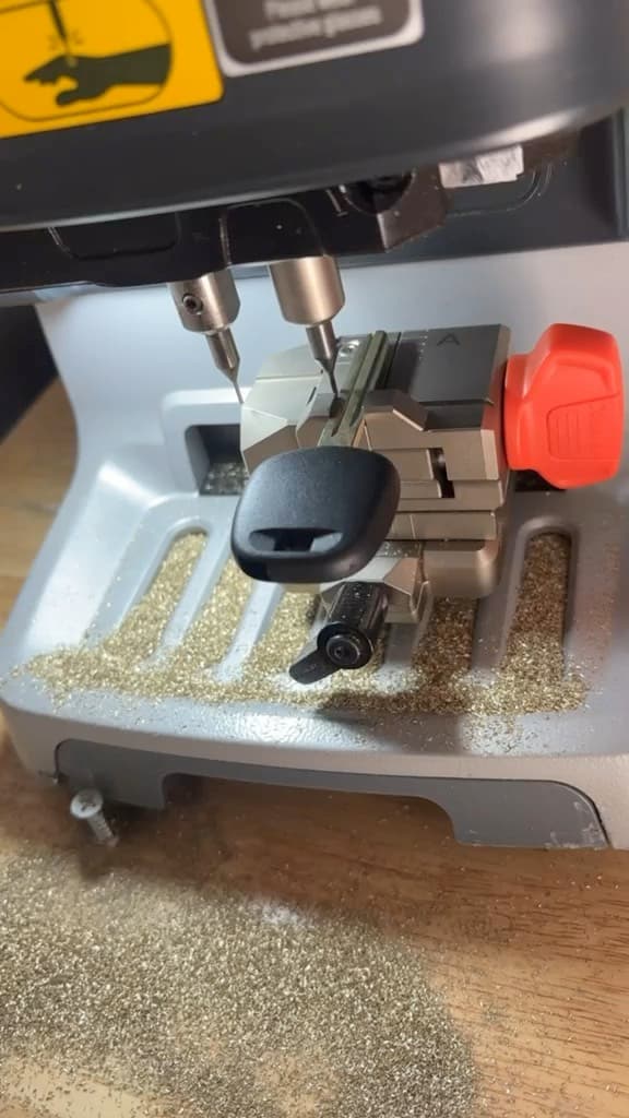 Car key being cut on a key-cutting machine