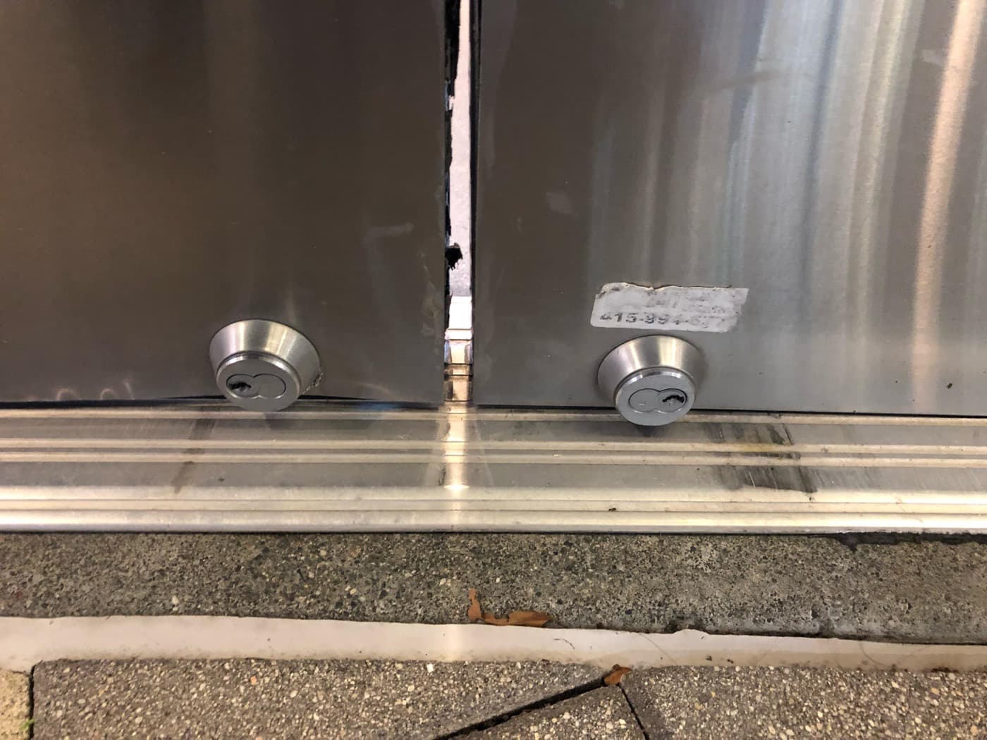 Floor locks installed on a storefront door