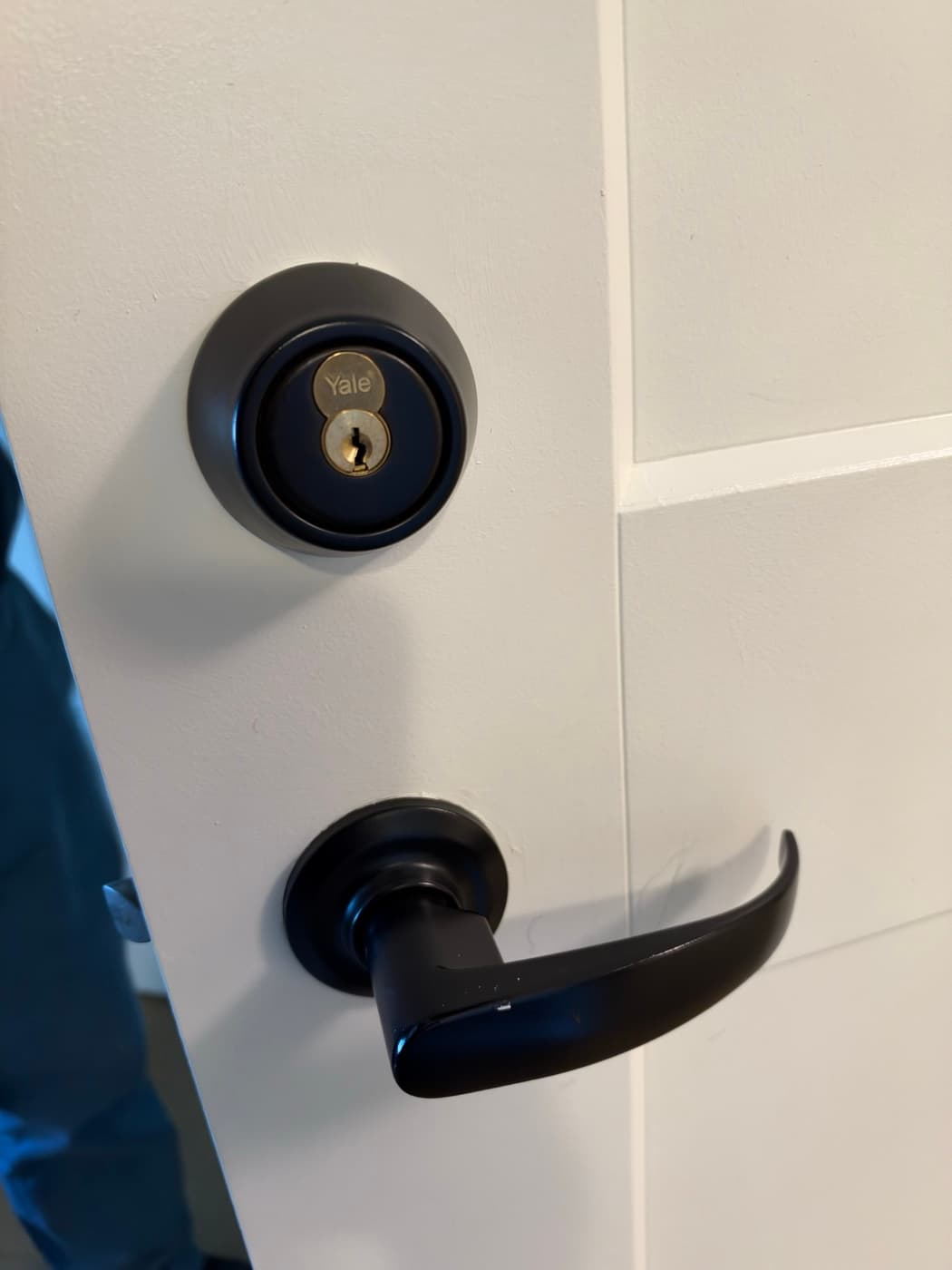 Matching deadbolt and lever handle installed
